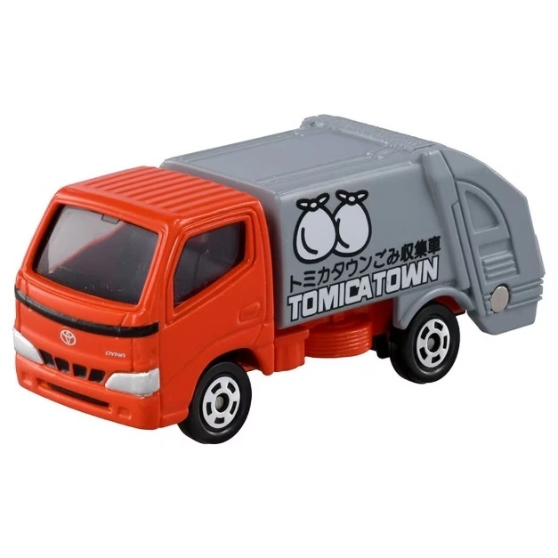  Orange and gray Tomica Town garbage truck toy with Japanese text and trash bag icons.